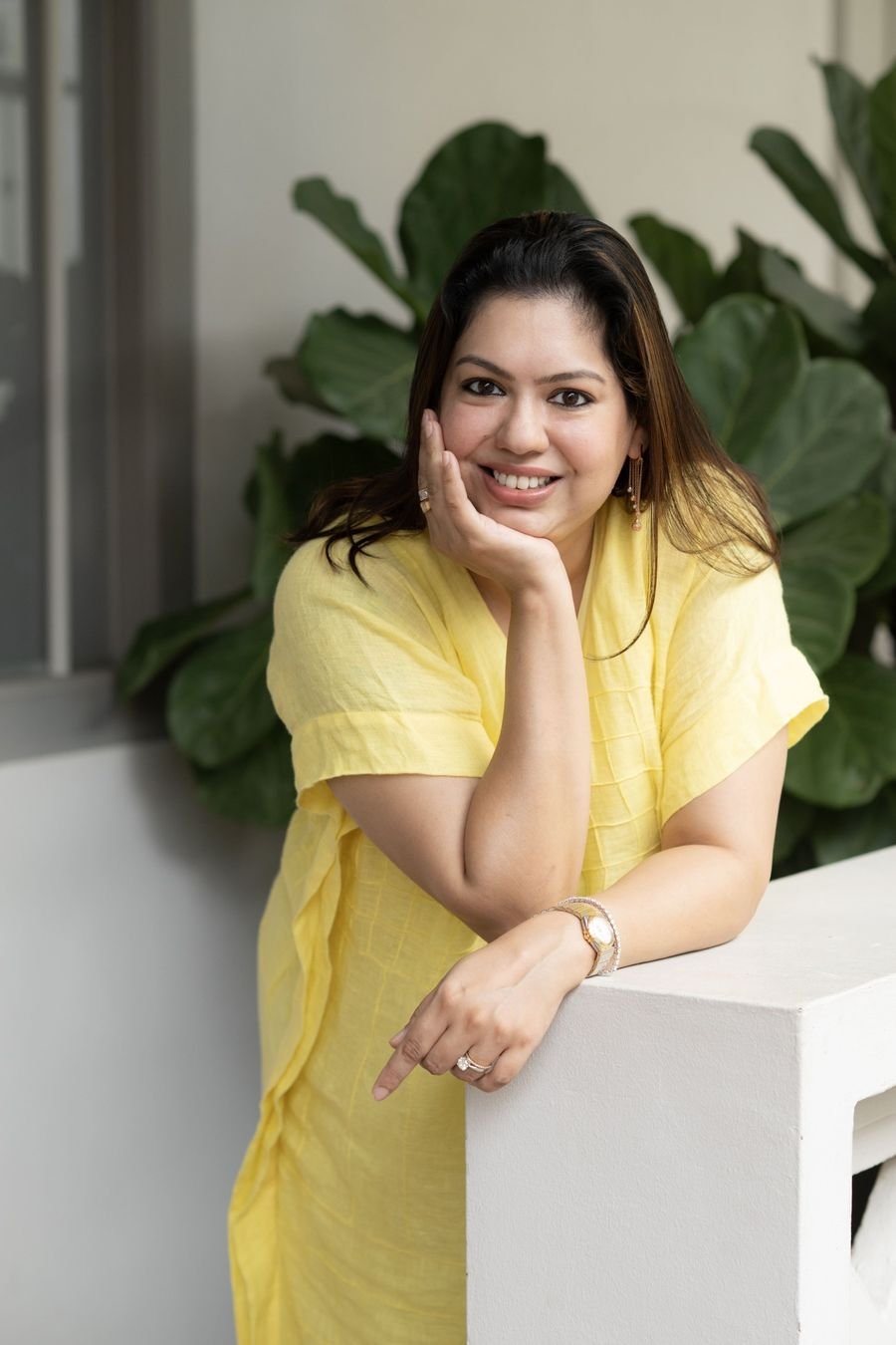 Shruti Swarup Khanna, Founder of Shruti Khanna Consulting, smiling in a yellow outfit